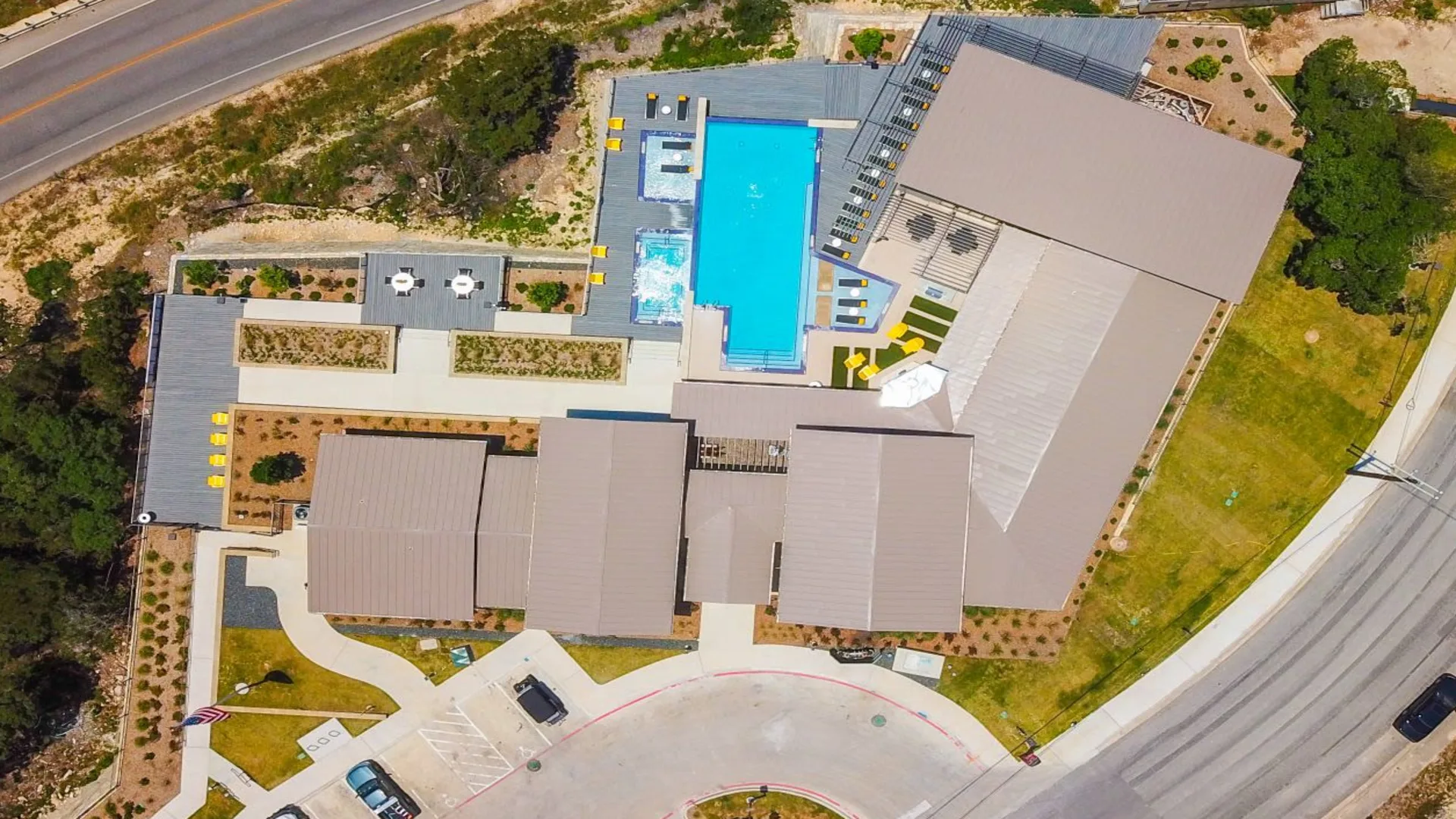 an aerial view of a pool and a building at The  View at Crown Ridge
