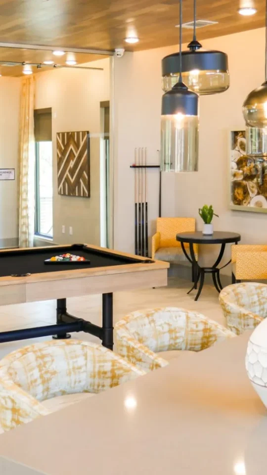 pool table in a living room with a dining area at The  View at Crown Ridge