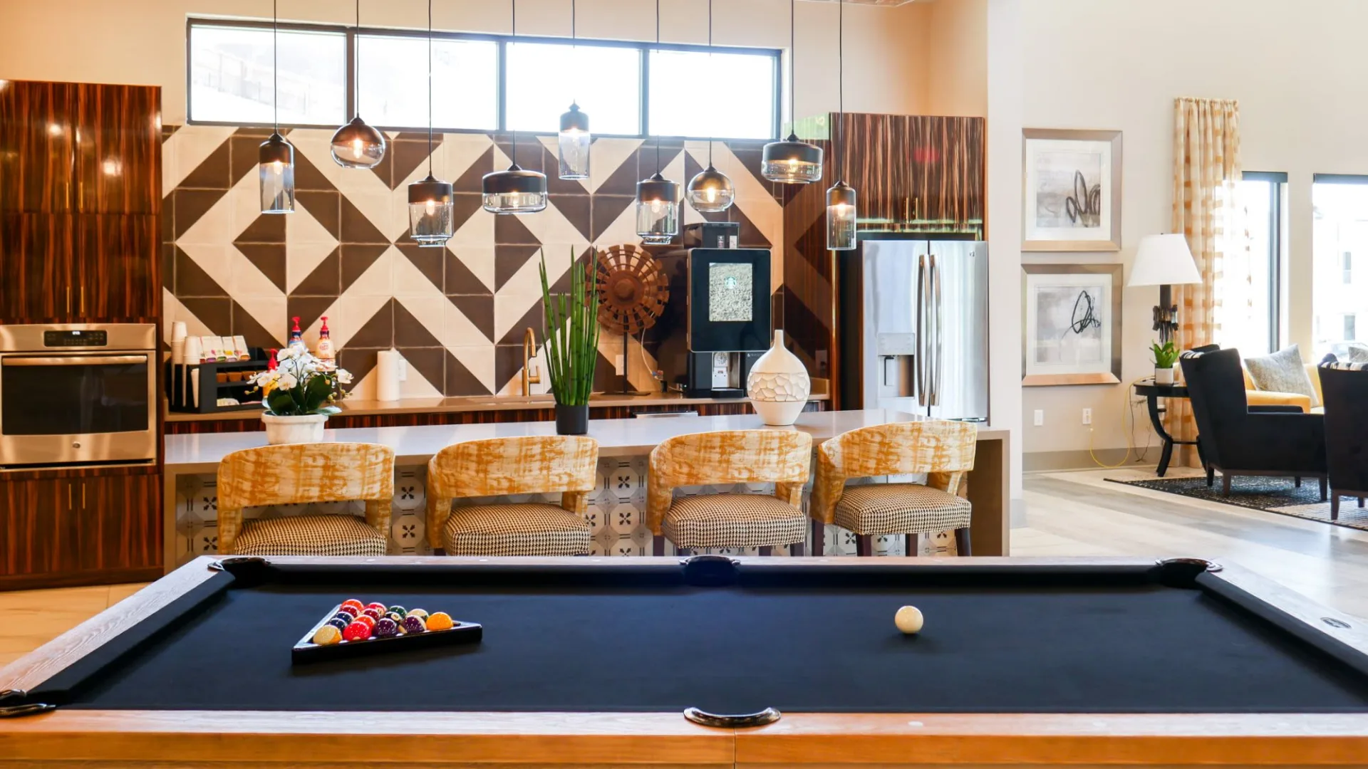 pool table in the living room of a home at The  View at Crown Ridge