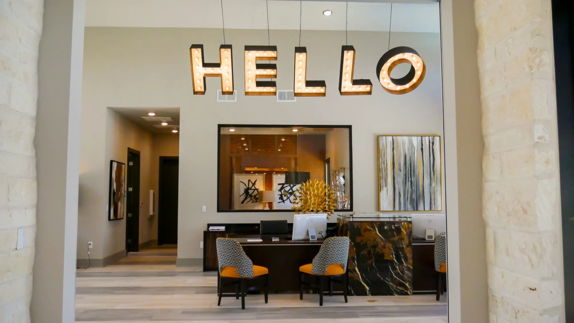 the hello sign is displayed in the lobby of a building at The  View at Crown Ridge